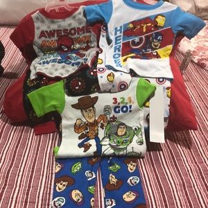 Three pair of superhero pajamas